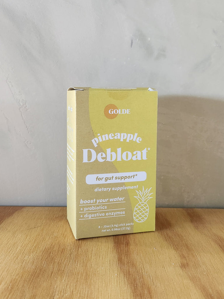 A box of 8 packs of debloat powder drink mixes.