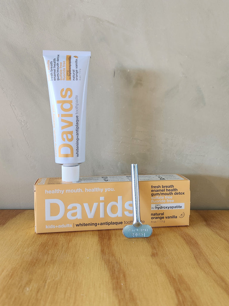 Davids orange vanilla toothpaste. Comes with a metal tube squeezer. 