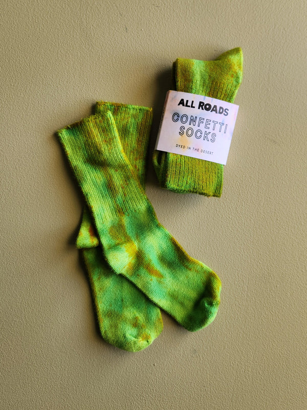 Bright green tie dyed socks. 