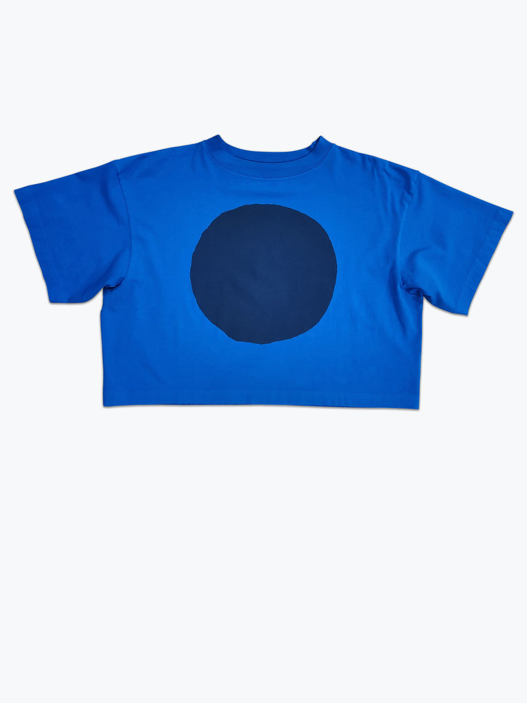 Boxy cropped t-shirt dyed bright blue with a large navy blue circle screen printed.