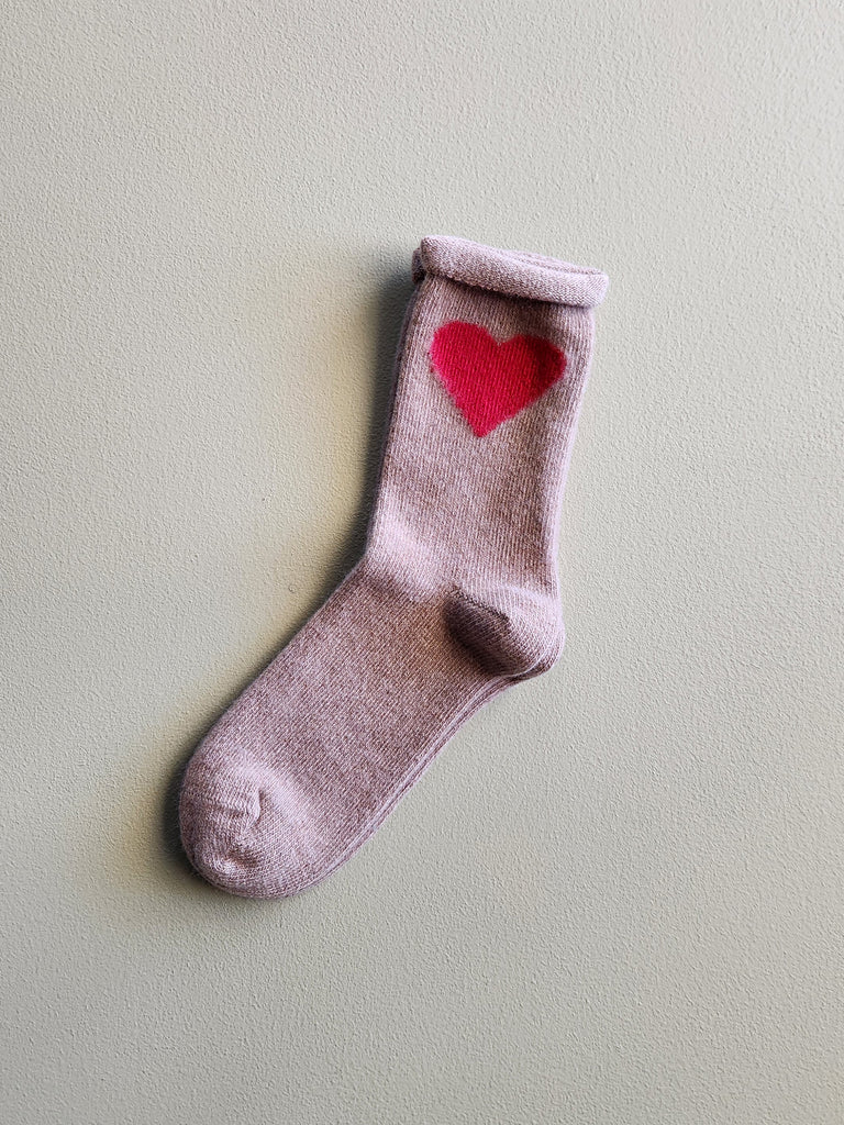 Tan cashmere women's crew sock with a red heart on the side.