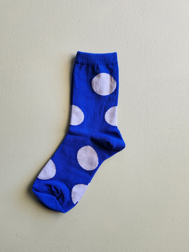 Cobalt blue women's cotton socks with pale blue polka dots all over.