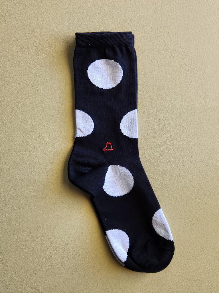 Black men's cotton crew sock with large white polka dots.