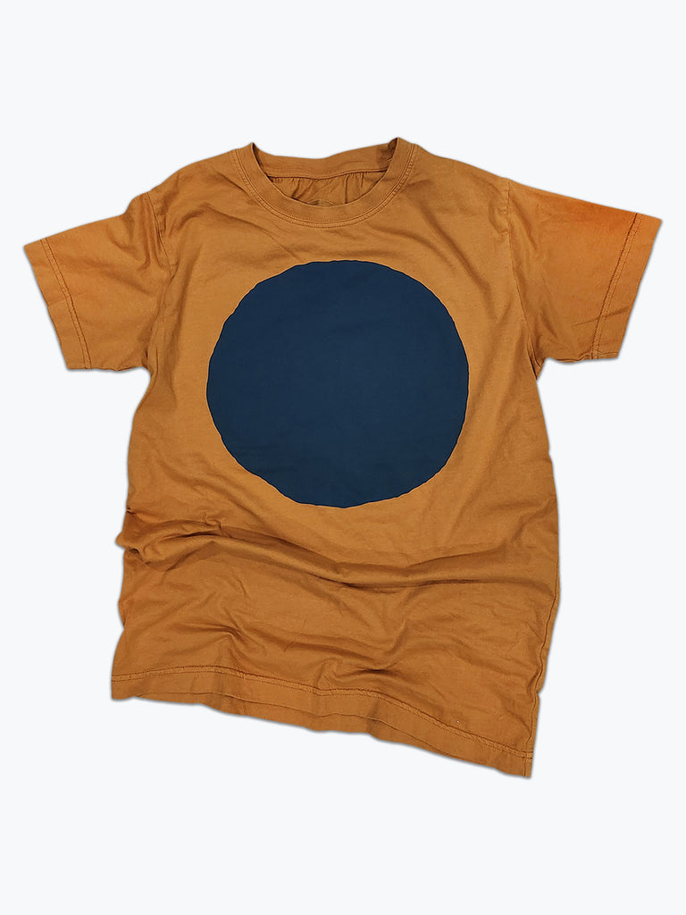 Ochre yellow t-shirt with large dark blue circle screen printed on the front. 