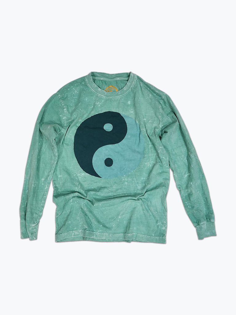 A light teal long sleeved t-shirt with a large tonal green ying yang screen print on the front.